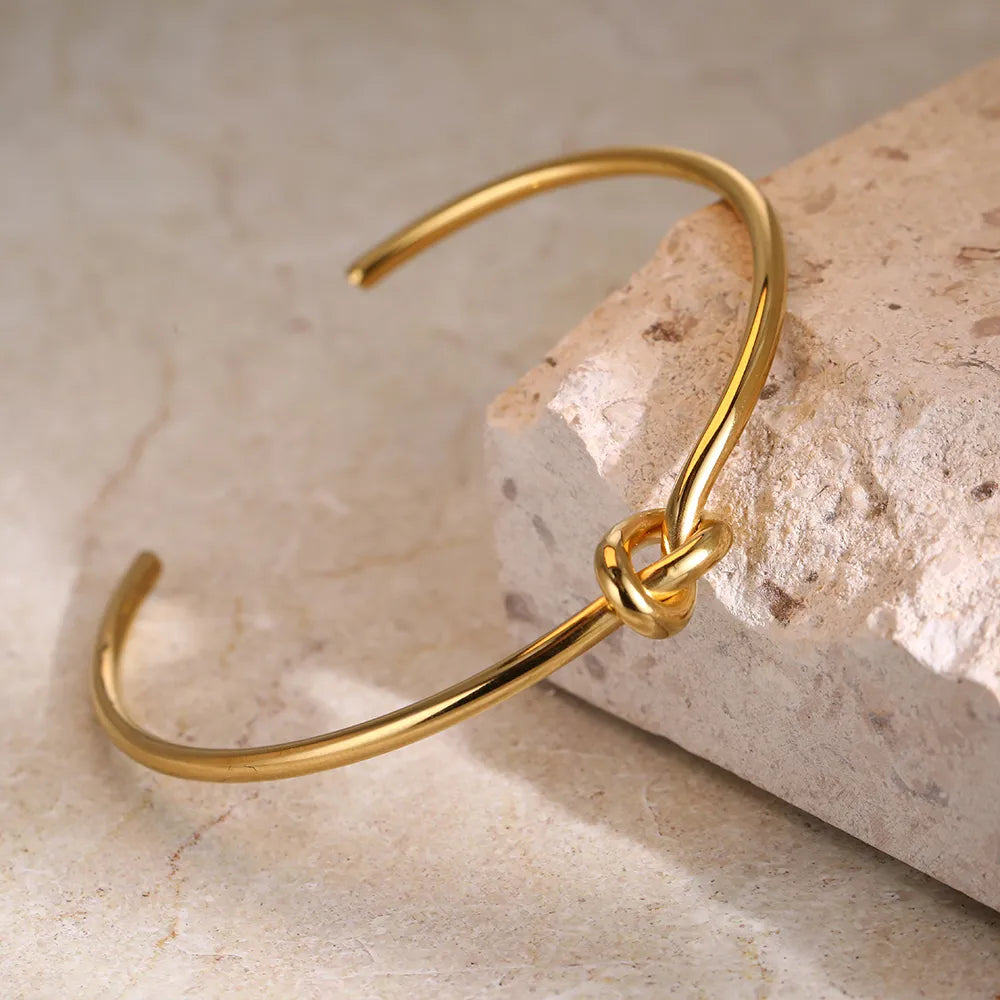 Allure | Twisted Knot Golden Bangle